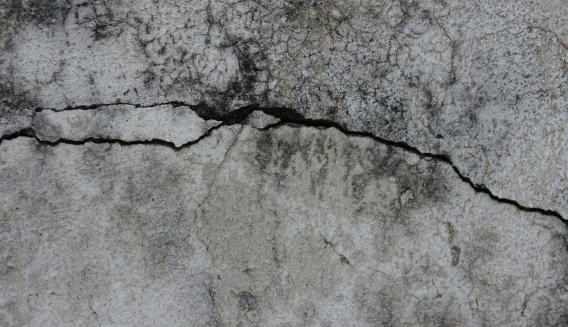 a concrete wall with visible cracks